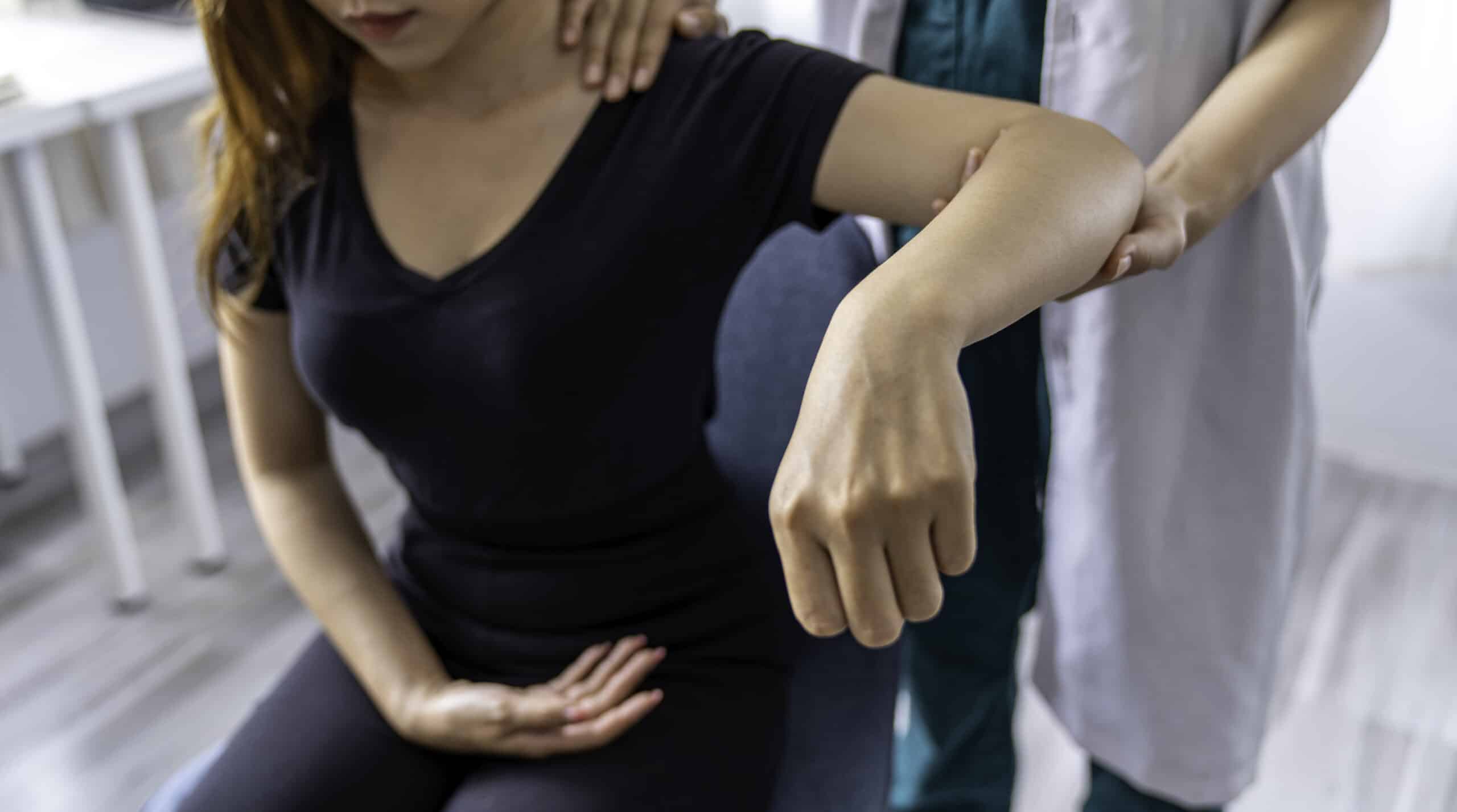 The doctor counsels the patient about pain in the muscles of the arms and elbows. office syndrome problem physical therapy diagnostic concept